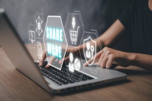 Shareware concept, Person working on laptop conputer with Shareware icon on virtual screen.